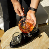 Don Vassie skull decanter set with 2 glasses and mahogany base
