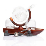 Don Vassie globe decanter set with 2 glasses and a boat shaped mahogany wooden base